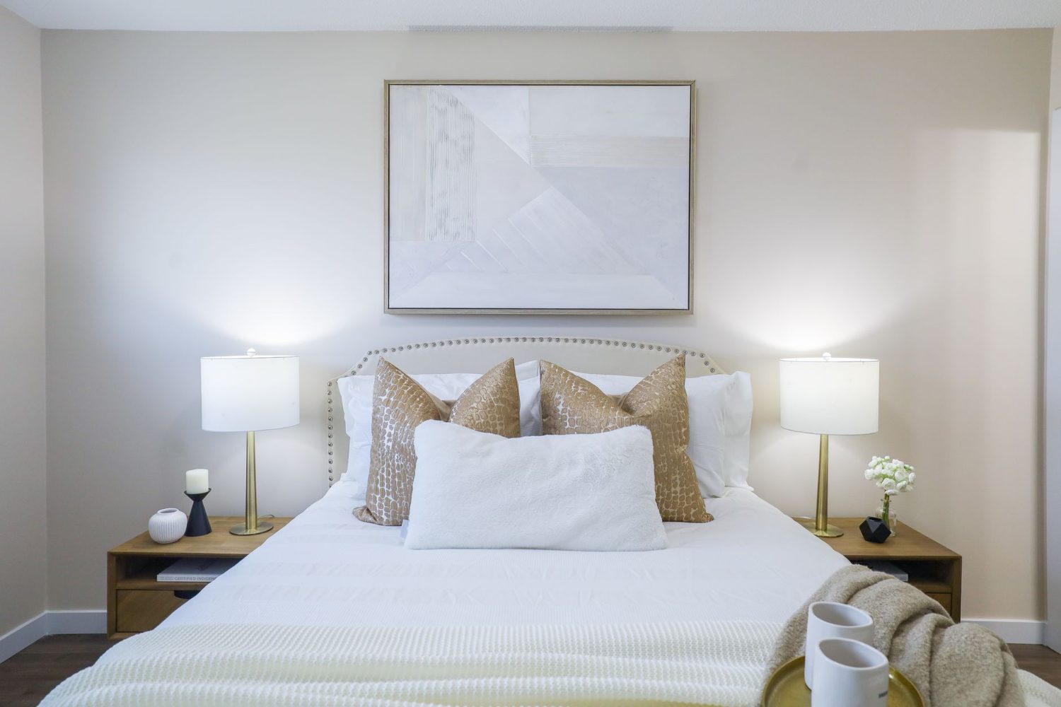 Styled bedroom with soft bedding and warm natural light